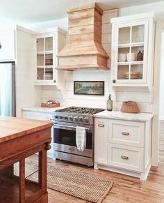 the instagram page shows an image of a kitchen with white cabinets and wood floors