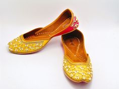 Ethnic Indian/Pakistani style shoes durable and hand stitched with genuine leather sole and leather padded cushion inside. These lovely pair of double colored khussa have a hand emroidered work. They offer comfort and style, while still looking fabulous in these. Perfect or brides or everyday outfits. We offer many different designs of shoes to choose from. See our page for more of our collection! We ship out in a timely matter, wrapped in care for a safe secure trip to your location. Thank you Embroidered Leather Slip-on Flats, Festive Embroidered Leather Flats, Traditional Flats With Dori Work For Summer, Diwali Handwork Slip-on Flats, Handwork Leather Closed Toe Flats, Handwork Leather Closed-toe Flats, Traditional Embroidered Slip-on Flats, Leather Closed Toe Flats With Handwork, Handwork Slip-on Flats For Festivals