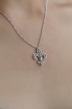 Beautiful Filigree Necklace with medieval symbol: The Fleur de Lys. The symbole of France and Quebec. Gift chain included. Necklace is silver 925 and it has 45cm long. Silver Fleur de Lys Necklace, Fleur de Lis, French Royalty Necklace, Jewelry Lys of Quebec, Quebec Jewellery, Jewel symbole of France Lovely option for anniversary or birthday gift. *Jewels for good luck* ✨ D I M E N S I O N S & V A R I A T I O N S✨ The diameter of the pendant is 0.8 inches (20 mm) and the height is 0.9 in (22 Medieval Style Metal Engraved Necklaces, Ornate Pendant Necklaces With Charms, Ornate Pendant Necklace With Charms, Medieval Sterling Silver Nickel-free Jewelry, Medieval Metal Pendant Necklaces, Medieval Style Metal Pendant Necklaces, Medieval Metal Pendant Necklace, Medieval Engraved Cross Pendant Jewelry, Medieval Sterling Silver Necklace In Silver