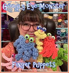 a woman sitting in front of some crocheted items with googly eye monster eyes