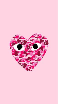 a pink heart with two eyes and hearts on the side, in front of a pink background