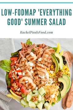 a salad with chicken, avocado and tomatoes in it