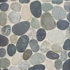 several different colored rocks are arranged on the wall in this mosaic tile pattern, which looks like it has been made out of stone