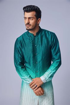 Editor's Note Step into elegance with this sage green ombre tagai kurta paired seamlessly with a matching pant. The subtle ombre effect in shades of sage green adds depth and dimension to the ensemble. The tagai detailing brings a touch of traditional charm to the kurta, making it a unique and eye-catching piece. Crafted with meticulous attention to detail, this sage green ombre tagai kurta and pant set offers both style and comfort. Perfect for special occasions or cultural celebrations, this e Formal Green Kurta For Spring, Spring Formal Green Kurta, Green Straight Kurta For Formal Occasions, Subtle Ombre, Vacuum Storage, Stitch Lines, Green Ombre, Pajama Pant, Ombre Effect