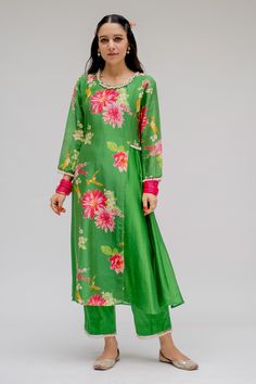 Green kurta in chanderi silk base with pearl embellished neckline and sleeves hem. Paired with cotton and hand embroidered pearl dupatta with printed borders.
Component: 3
Pattern: Printed
Type Of Work: Digital Print
Neckline: Round
Sleeve Type: Straight
Fabric: Chanderi Silk; Cotton; Lining: Shantoon
Color: Green
Other Details: 
A-line kurta
Pearl embellished hem
Occasion: Mehendi and Haldi - Aza Fashions Chanderi Sharara With Printed Motifs, Chanderi Straight Kurta Sharara With Printed Motifs, Cotton Silk Sharara With Printed Motifs, Silk Straight Kurta With Printed Motifs, Festive Silk Kurta With Printed Motifs, Designer Silk Kurta With Printed Motifs, Cotton Silk Kurta With Printed Motifs, Festive Silk Kurta With Floral Print, Designer Chanderi Kurta With Printed Motifs