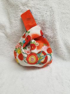 A Japanese style knot bag made from an upcycled vintage kimono. This bag hangs from the wrist normally and has a single pocket. Handmade. 100% cotton inside to help reinforce the older fabric. Quality and type of kimono material content may vary. Many of the vintage kimonos have holes and other imperfections I have tried my best to work around. Knot Bag, Vintage Kimono, Japanese Kimono, Upcycled Vintage, Japanese Style, Kimonos, Wristlets, The Vintage, Bag Making