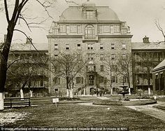 an old black and white photo of a large building