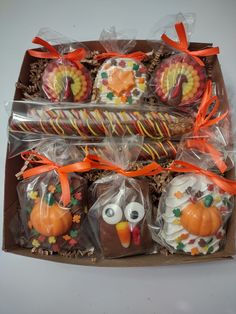 a box filled with cookies and candies decorated like turkeys on top of each other