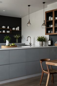 the kitchen is clean and ready to be used for cooking or eating, while also being used as a dining room