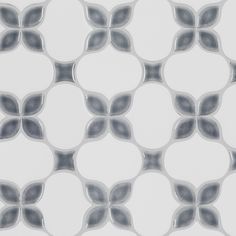 a white and gray tile pattern with circles