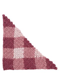 a pink and white checkered crocheted blanket