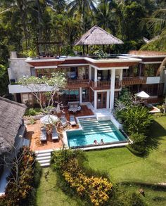 an aerial view of a house with a swimming pool