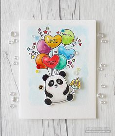 a birthday card with a panda holding balloons