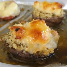 baked potatoes with cheese and sauce in a pan