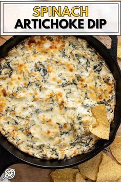 spinach artichoke dip in a cast iron skillet with tortilla chips