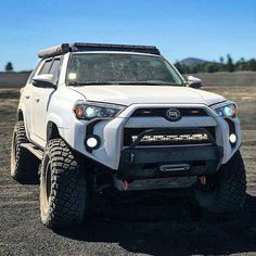 the front end of a white toyota 4runner