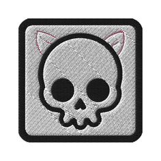 a patch with a skull and cat's head on it