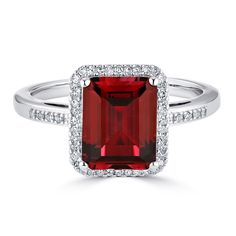 This beautiful lab-created red ruby ring will be a valued addition to your jewelry collection.  Surrounded by a halo of white diamonds this ring adds shine and beauty to any wardrobe, from jeans to that special black dress.  The perfect birthstone for July birthdays or any special holiday. Available in 6 colors.  Lab-Created Emerald, Lab-Created White Sapphire, Lab-Created Ruby, Lab-Created Blue Sapphire, Amethyst, and Blue Topaz. Silver Gemstone Rings, Red Ruby Ring, Sam's Club, Blue Sapphire Rings, Red Ruby, Eye Jewelry, Ruby Ring, Topaz Gemstone, Sapphire Gemstone