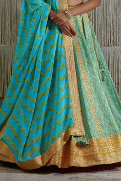 Shop for Shyam Narayan Prasad Blue Cotton Satin Gota Work Lehenga Set for Women Online at Aza Fashions Blue Sharara With Zari Weaving For Festivals, Blue Pre-draped Saree With Gota Work, Festive Blue Sharara With Zari Weaving, Blue Sharara With Traditional Drape And Zari Weaving, Designer Blue Lehenga With Motifs, Blue Sharara With Zari Weaving For Wedding, Transitional Blue Lehenga With Motifs, Blue Semi-stitched Anarkali Set With Zari Weaving, Semi-stitched Blue Anarkali Set With Zari Weaving