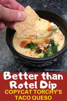 a person dipping tortilla chips into a bowl