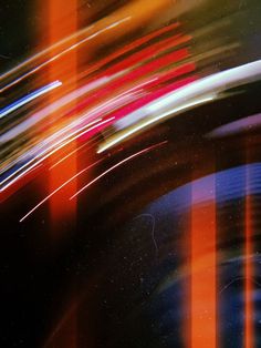 an abstract photo with lines and colors in the background, including blue, red, orange, and white