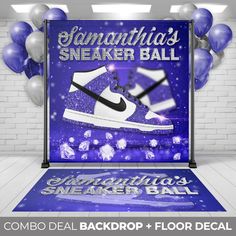 a blue and white basketball themed backdrop with balloons in the background, including a pair of sneakers