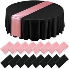 black and pink round tablecloths with satin ribbons on each side, along with matching place mats