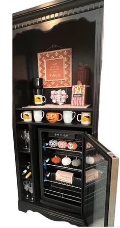 an open refrigerator filled with lots of different foods and drink items on top of it