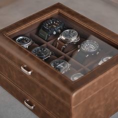 Expertly handcrafted to protect, organize and display the finest of collections, the Bayswater 8 Slot Watch Box for men is tailored to fit a minimum of 8 wrist watches as well as other watch and lifestyle accessories across its double layer design. The main compartment of the watch display case consists of eight individual slots, which house 2.15”(55mm) wide pillows, providing ample storage for a collection of oversized watches. The valet drawer features four 2"(50mm) wide slots, perfect for sto Business Brown Box Watch Accessories, Business Brown Watch Accessories Box, Brown Rectangular Watch Case For Formal Occasions, Brown Rectangular Case Watch Accessories For Formal Occasions, Formal Brown Watch Accessories With Rectangular Case, Timeless Brown Watch Accessories For Gift, Watch Box For Men, Leather Watch Case, Watch Display Case