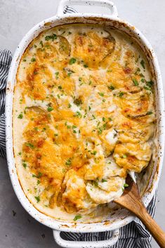 a casserole dish filled with chicken and cheese