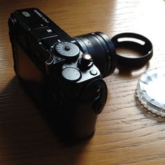 a camera sitting on top of a wooden table