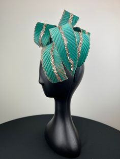 This gal is beyond elegant - a true wow. Loads of heavy velvet teal feathers, accented with crystals and glam, are shaped into a dramatic shape.  Looks equally pretty worn to the right or the left- both ways shown in photos. Sits on a comfortable black headband. Ships in a high quality storage box. One of a kind.  Perfect for Kentucky Derby, Royal Ascot, church, weddings, just for fun. Teal Fascinator, Blue Curved Brim Evening Fascinator, Blue Feathered Summer Fascinator, Blue Feathered Hat Fascinator, Luxury Hat-shaped Fascinator For Ceremonies, Black Headband, Royal Ascot, Kentucky Derby, Just For Fun