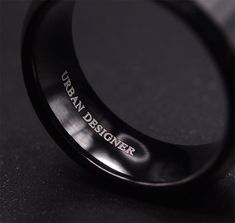 Make a statement with our 8mm black tungsten wedding ring for men, where sophistication meets style. Crafted for durability and timeless appeal, this ring is the perfect symbol of your commitment. The band measures 8 mm wide and 2.5 mm thick to provide that high end feel with eye catching and fashionable look. Free Ring Box included. Classic Men's Black Ring, Elegant Black Tungsten Carbide Rings, Cheap Men's Black Stainless Steel Ring, Modern Black Tungsten Carbide Jewelry, Cross Jewelry Necklace, Wooden Watches For Men, Tungsten Carbide Wedding Bands, Tungsten Wedding Rings, Black Tungsten