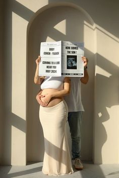 a man and woman are holding up signs