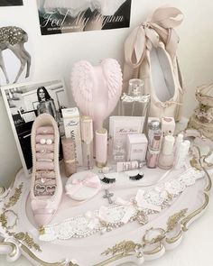 a white tray topped with lots of different types of cosmetics and personal care items on top of a table