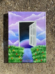 an open door to another world is shown on the ground with grass and flowers in front of it