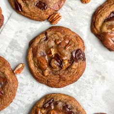 chocolate chip cookies with pecans and nuts on top