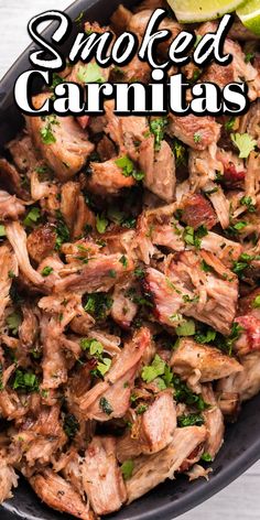 a skillet filled with meat and garnished with cilantro on top