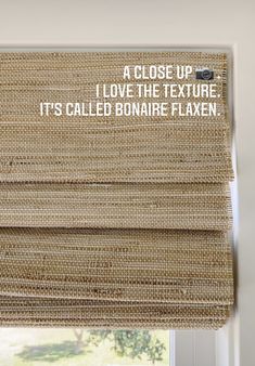 a close up of a roman blind with the words i love the texture it's called bonar flaxen