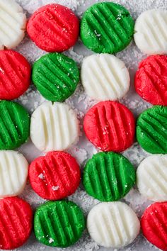 some red, green and white cookies are on the table