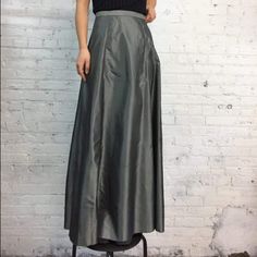 Almost New Gray Taffeta/Organza Long Skirt In Sz S. I Have Worn It In The Past With A Black Embroidered Or Gray Sequined Top. Black Top Is Listed Separately. Very Useful For A Sudden Event Since It Can Be Easily Dressed Up Or Down. Fully Lined As It Is Transparent Otherwise. No Defects Noted And Worn 2 Times For Functions - Pristine Condition Fitted Silk Pleated Maxi Skirt, Silk Skirted Bottoms For Party, Fitted Silk Maxi Skirt, Fitted Silk Maxi Full Skirt, Fitted Full Silk Skirt, Silk Full Skirt Bottoms For Party, Silk Maxi Skirt For Party, Skirted Satin Bottoms For Party, Silk Full Maxi Skirt For Party