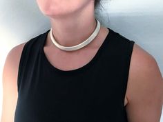 "Vintage Designer Signed Modernist Tubular Brushed Sterling Silver Choker Necklace. Clean bold modernist minimalist design featuring thick brushed silver three dimensional tube measuring 11.5mm thick around. Nice elongated oval look. Cleaned ready to wear. Rigid design with no flex, please ensure measurements below will suit you needs. We have a matching bangle bracelet if interested. See our other listings. Markings: Tst, 925 Measurements: 14 1/2\" inside circumference including neck opening, 4 Modern Silver Everyday Choker, Modern Silver Choker For Everyday, Minimalist Silver Choker For Everyday, Everyday Minimalist Silver Choker, Adjustable Modern Sterling Silver Choker, Cuff Necklace, Sterling Silver Choker Necklace, Elongated Oval, Sterling Silver Choker