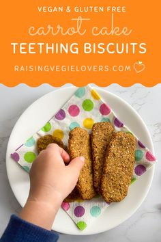 vegan and gluen free carrot cake teeth biscuits on a white plate with polka dot napkin