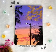 a painting of a street light and palm trees in the sunset with butterflies around it