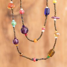 A myriad of colors, gorgeous crystals and elegant glass beads come together in a bohemian design full of cheerful energy. Handcrafted by Mirian Zet from Guatemala, this beaded long necklace is the perfect complement to a vibrant style, as its diverse hues make it shine with unique light. Multicolor Beaded Chain Spiritual Crystal Necklaces, Artisan Multicolor Beaded Long Necklace, Multicolor Beaded Chain Crystal Necklace, Spiritual Style, Multicolor Beaded Chain Crystal Necklaces With Spiritual Style, Spiritual Multicolor Beaded Chain Crystal Necklaces, Spiritual Multicolor Crystal Necklaces With Beaded Chain, Bohemian Multicolor Faceted Beads Crystal Necklaces, Bohemian Multicolor Faceted Beads Crystal Necklace, Bohemian Glass Beaded Necklace With Natural Stones