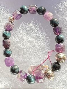 Faceted Amethyst & Blue Tiger Eye Stretch Bracelet with Sterling Silver Beads Healing Bracelet With Faceted Beads, Purple Beaded Stretch Bracelet For Healing, Handmade Amethyst Stretch Bracelet, Amethyst Beaded Stretch Bracelet With Round Beads, Amethyst Beaded Stretch Bracelet, Healing Amethyst Bracelets With Faceted Beads, Spiritual Purple Bracelets With Faceted Beads, Purple Spiritual Bracelets With Faceted Beads, Spiritual Amethyst Bracelets With Polished Beads