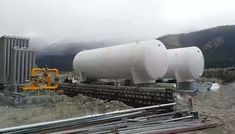 a large white tank sitting on top of a construction site