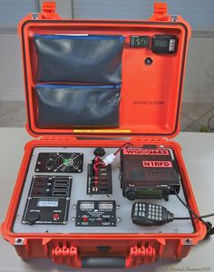 an orange case with electronic equipment in it