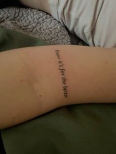 a person with a small tattoo on their arm