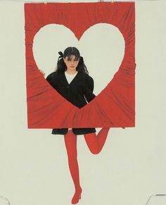 a drawing of a woman holding a red heart shaped frame with her legs spread out